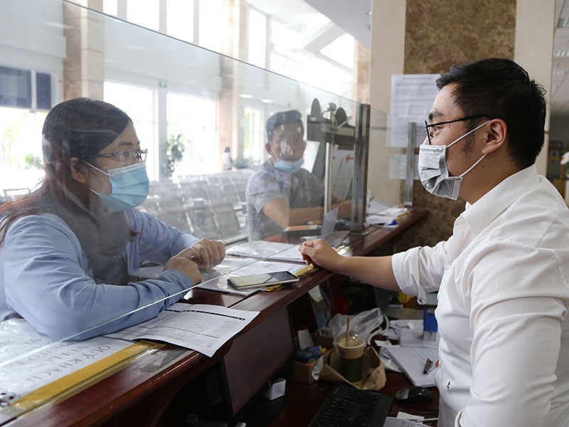 Quy định thuế TNDN tại Nghị định 126 là không phù hợp thực tế. Trong ảnh: Doanh nghiệp làm thủ tục thuế tại Cục Thuế TP.HCM